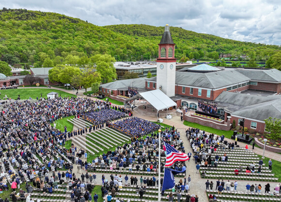 Aerial view of Commencement with thousands of guests and hundreds of graduates